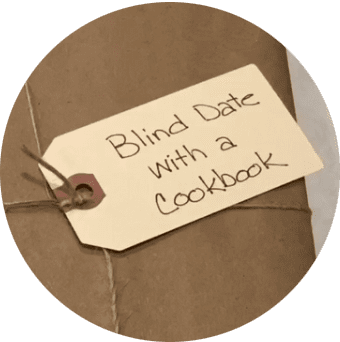 Blind Date with a Cookbook tag on a brown paper wrapped cookbook