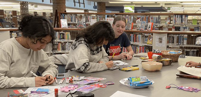 Teens crafting and hanging out in the Teen Area.