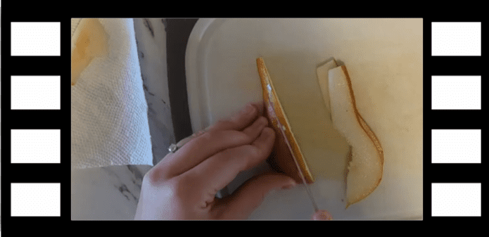 Image of person cutting pears with a frame that looks like a film strip.