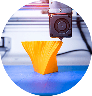 3D printer printing orange abstract shape