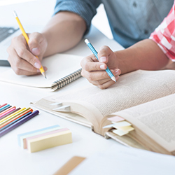 An adult helping a child with their homework