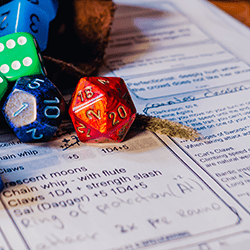 Dungeons & Dragons dice and character sheet