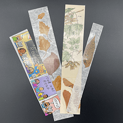 Bookmarks made from old book pages, dried leaves, and recycled materials