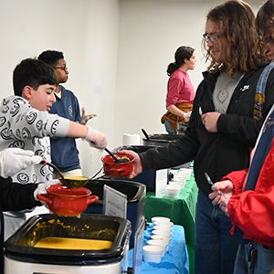 Serving line at a free Community Meal at the Coralville Public Library