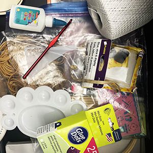 a pile of miscellaneous craft supplies