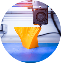 3D printer printing orange abstract shape